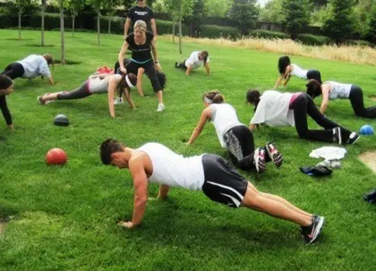 gorup-of-people-pushing-up