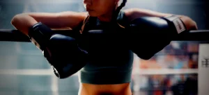 team_bootcamp_slider_Image_of_women_boxer-hanging_over_ring